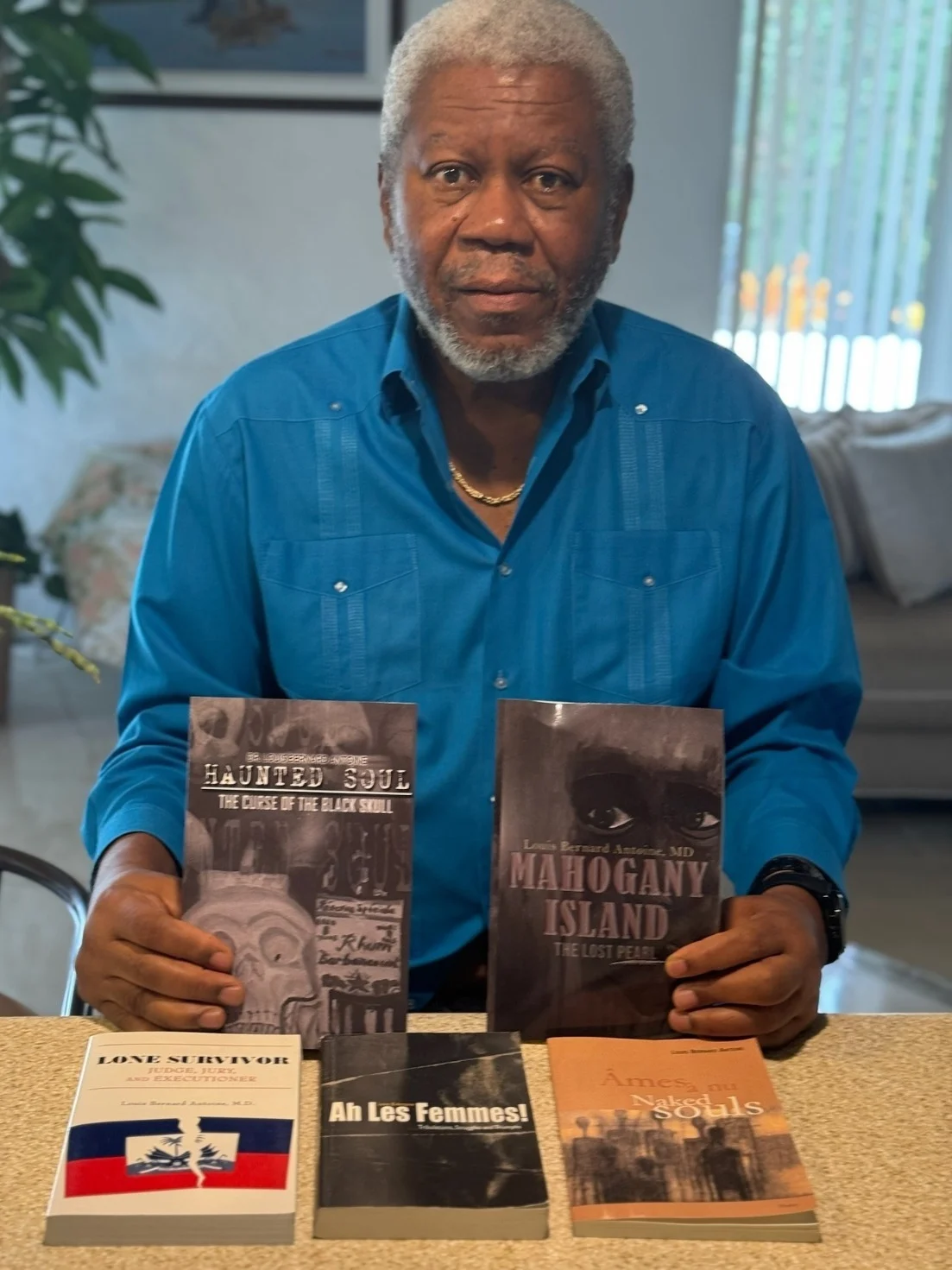 Dr. Louis Bernard Antoine with his published books